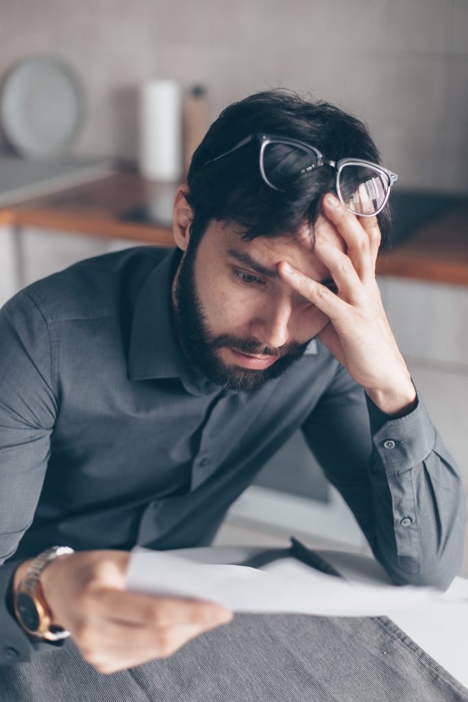 A man looking at a document.