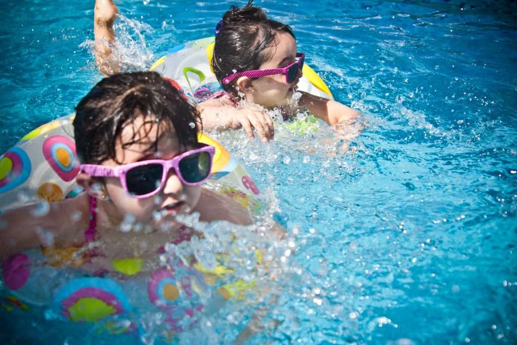 Two kids swimming.