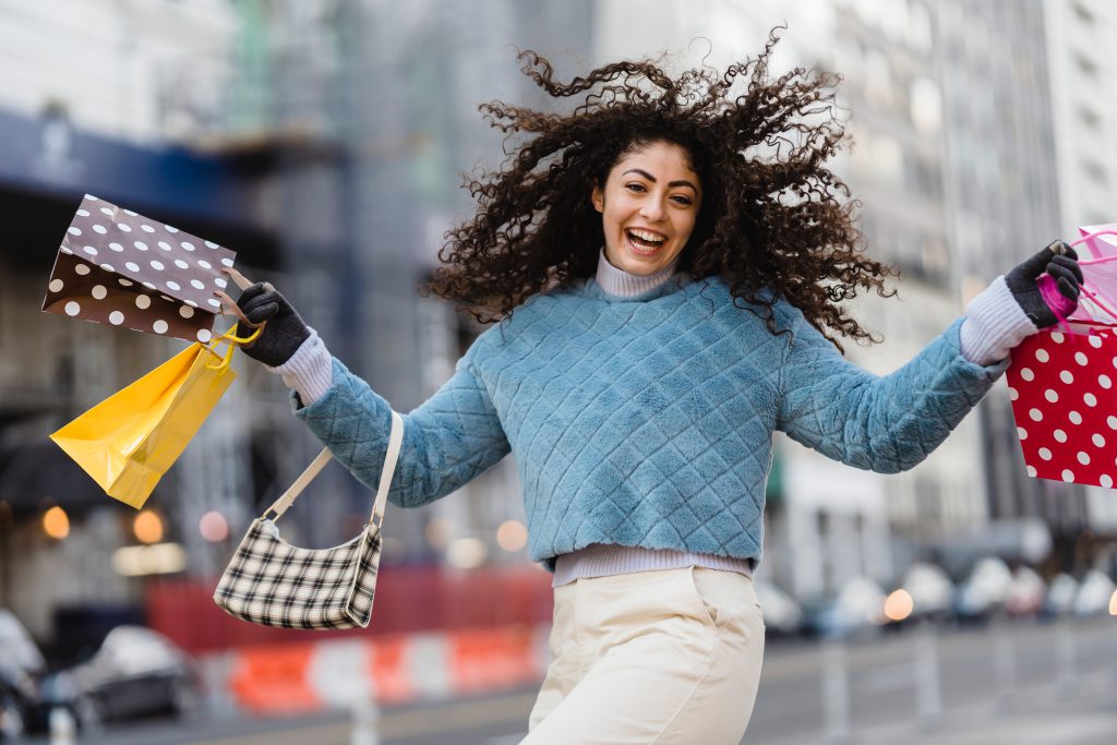 A woman with multiple shopping bags.