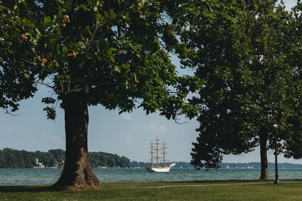 A small boat sailing in the distance.