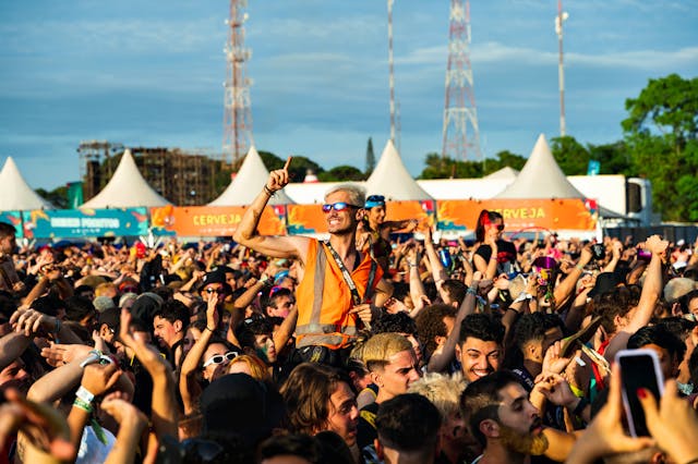 A crowd of people having fun at a festival.