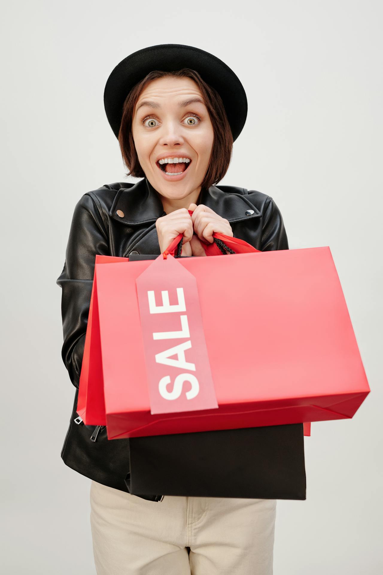 A woman holding shopping bags.