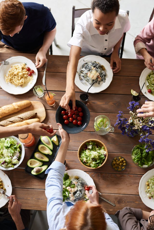 A group of people eating together.