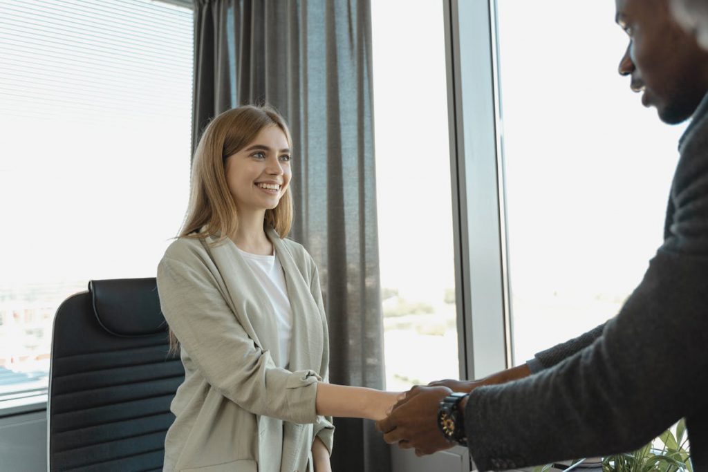 A man and a woman shaking hands.