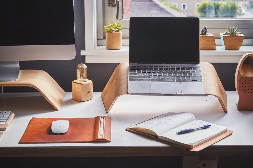 A work station with a monitor and laptop.